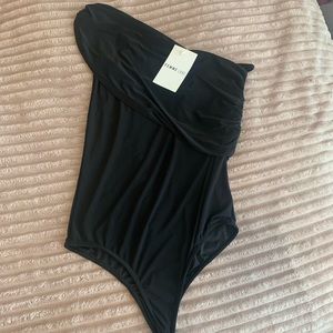 NWT Femme Luxe slinky one sleeve bodysuit